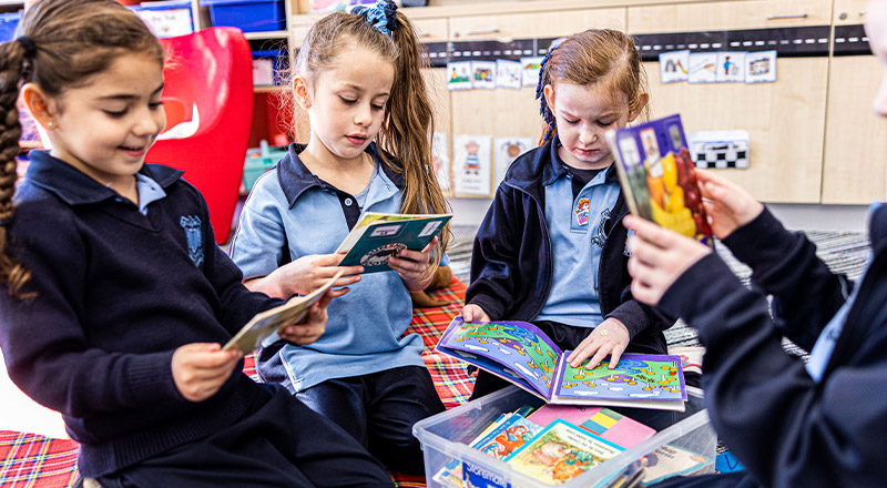Children reading books at St Madeleine's Catholic Primary School Kenthurst